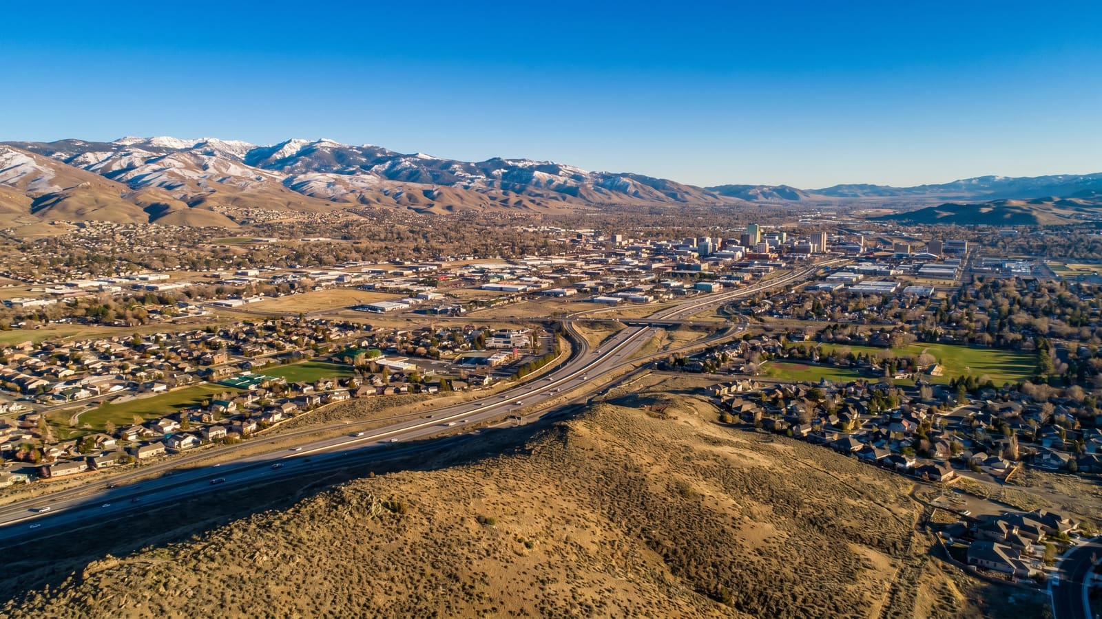 Reno-Sparks Truckee Meadows valley with Sierra Nevada — Reno luxury market new construction 2026